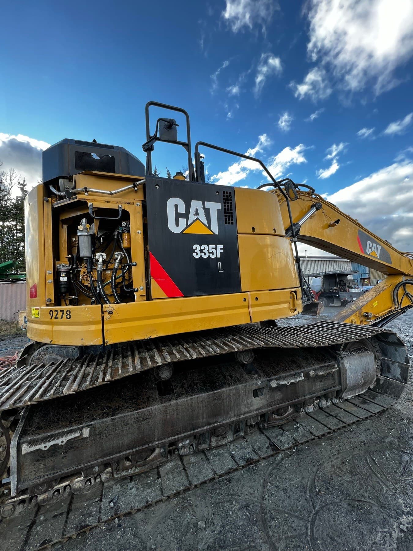 Clean CAT excavator after an on-site wash